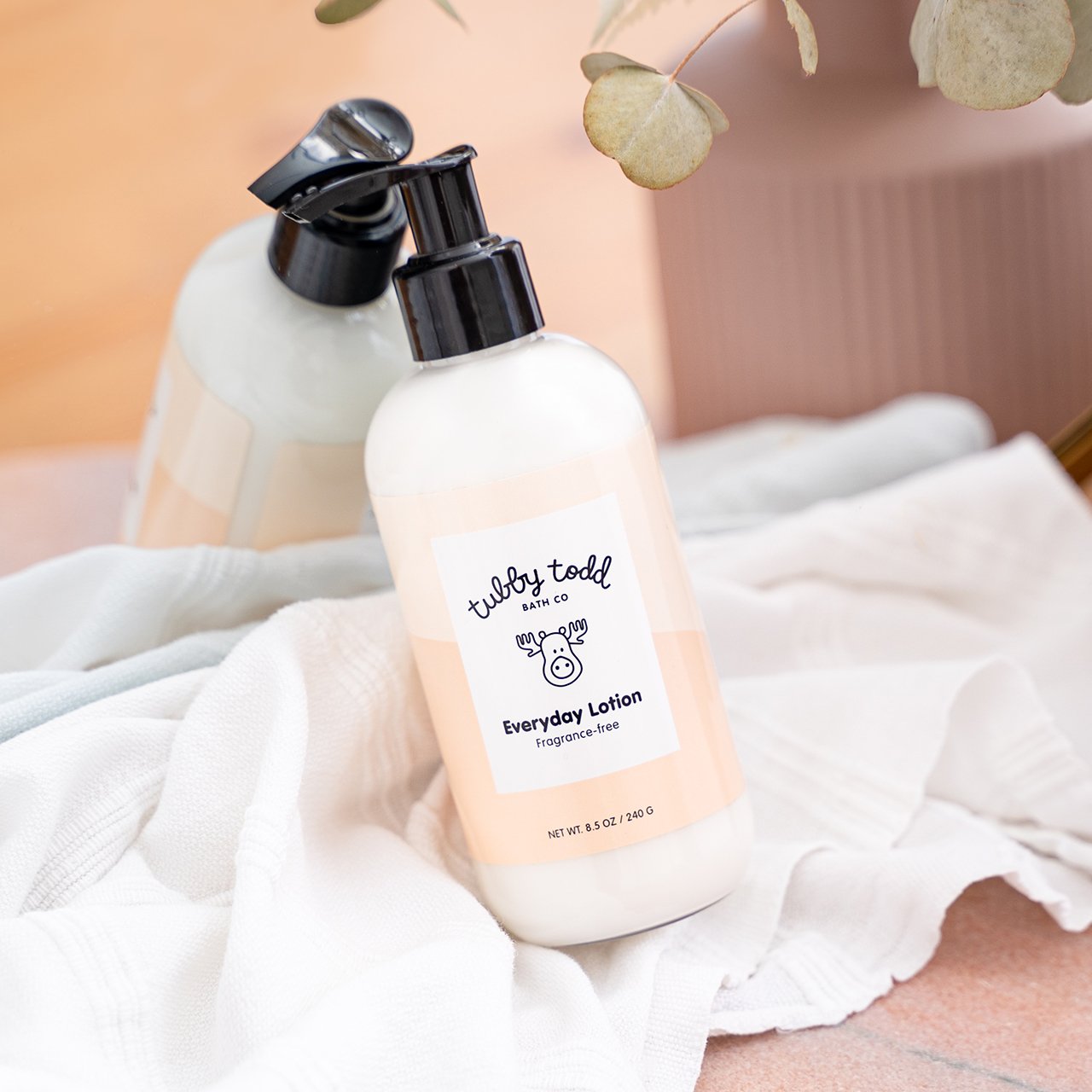 Fragrance-Free EDL 8.5oz bottle leaning on the mirror